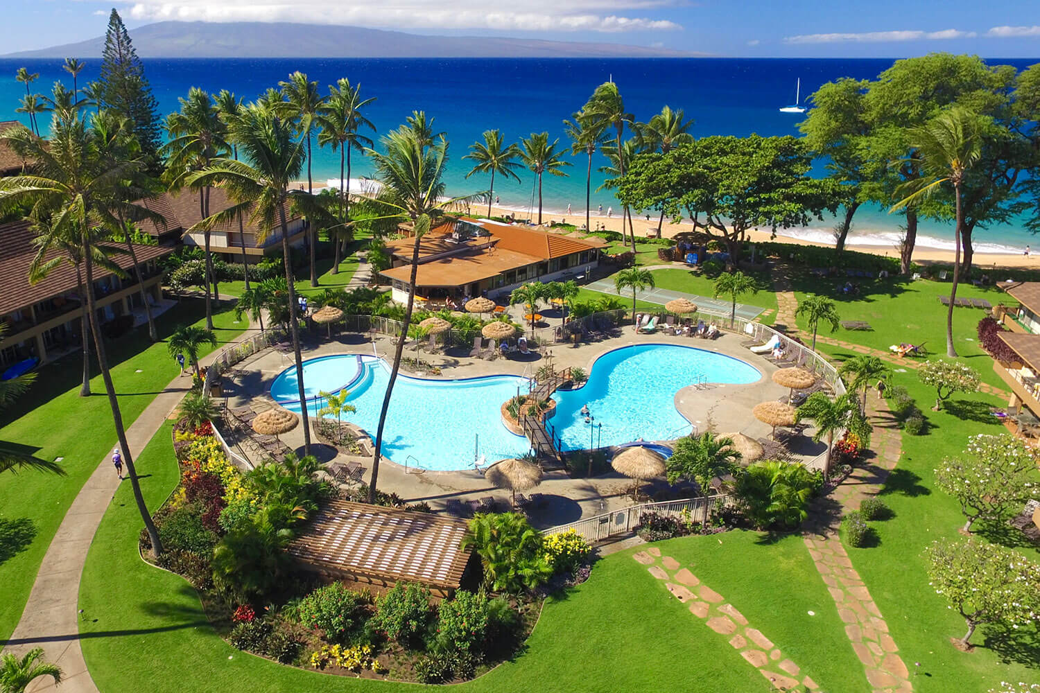 Aerial view of resort pool and beachfront.